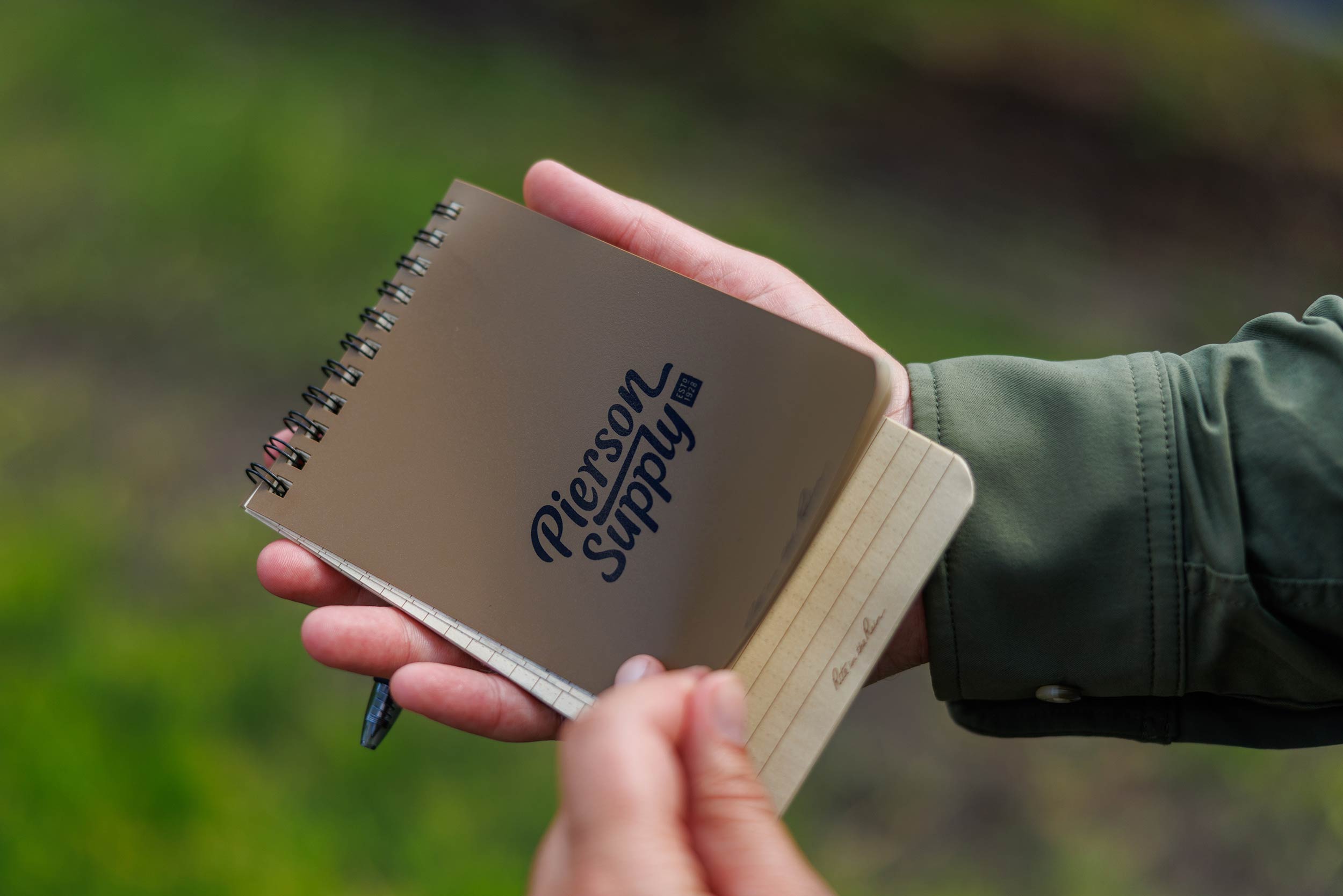 A Pierson Supply notepad held in hands